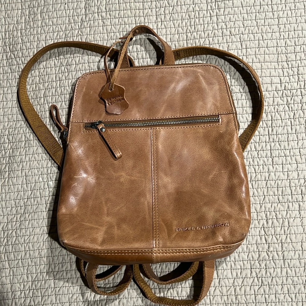 Spikes and Sparrow tan leather backpack.